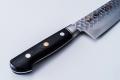 MINONOKUNI HIRO, 7.1 inch Forged VG10 with 16 Layers of Hammered Stainless Steel Damascus, Santoku type Double Edged, Black Micarta Handle